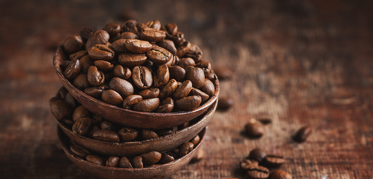 coffee-beans-wooden-small-bowls-old-wooden-vintage-background-closeup